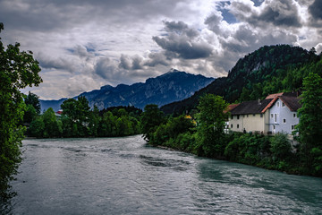 Fototapeta na wymiar Traditional, colorful buildings and the river Lech in the historic old town of Füssen, a romantic medieval city on the Romantic Road in Bavaria, Germany