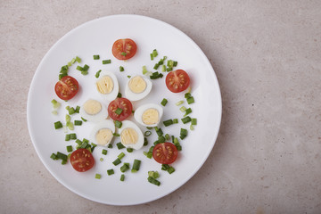 natural nutritious diet vegetable salad of tomatoes and quail eggs