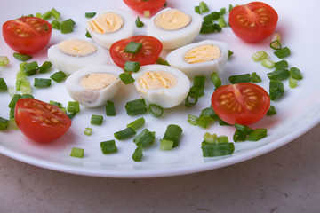 natural nutritious diet vegetable salad of tomatoes and quail eggs