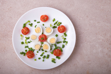 natural nutritious diet vegetable salad of tomatoes and quail eggs