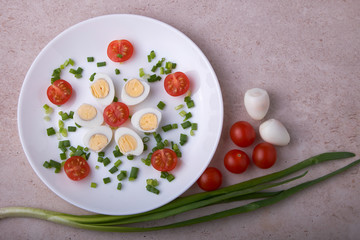 natural nutritious diet vegetable salad of tomatoes and quail eggs