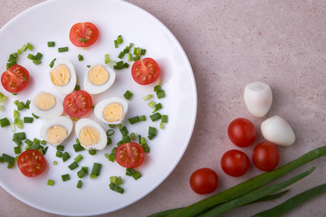natural nutritious diet vegetable salad of tomatoes and quail eggs