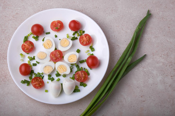 natural nutritious diet vegetable salad of tomatoes and quail eggs