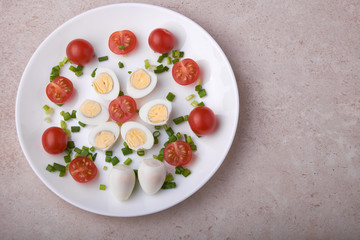 natural nutritious diet vegetable salad of tomatoes and quail eggs