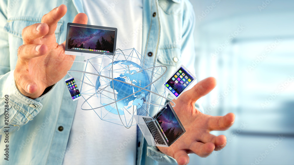 Poster businessman holding a computer and devices displayed on a futuristic interface with international ne