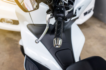 Close up of handlebars and front break system on motorcycle
