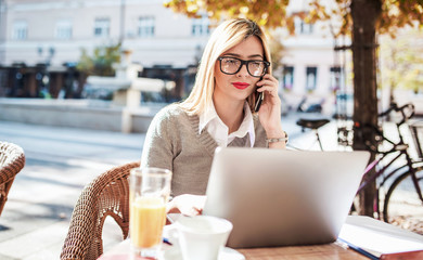 Business woman on coffee break in a cafe. Business, education, lifestyle concept