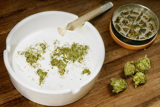 Ground weed in the shape of the world with a joint. (series)
