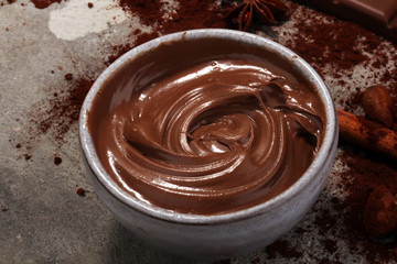 Chocolate bars on table with chocolate powder.