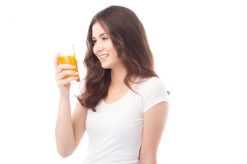 Portrait of a woman drinking orange juice. Orange juice in glass