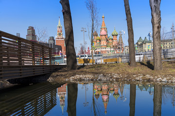 Moscow,Russia, St. Basil's Cathedral and water reflection and Kremlin Walls and Tower in Red square with sunny blue sky background and . Red square is Attractions popular's touris in russia