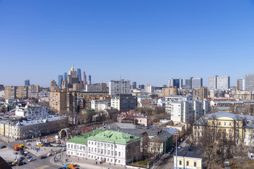 Fototapeta na wymiar view of Moscow cityscape, old historical town and urban skyscrapers (Moscow International Business Center background) with sunny blue sky, Moscow city, Russia