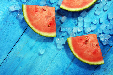 watermelon on blue background. juicy summer fruit in slices