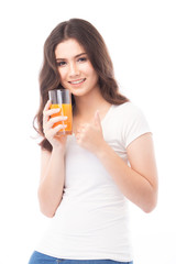 Portrait of a woman drinking orange juice. Orange juice in glass