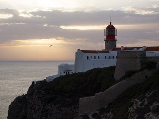 Fototapeta na wymiar Lighthouse of Saint Vincent cape sunset, Sagres, Algarve, Portugal.