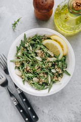 Quinoa salad with arugula and almonds. Vegetarian lunch bowl.
