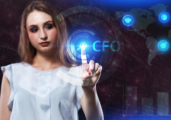 The concept of business, technology, the Internet and the network. A young entrepreneur working on a virtual screen of the future and sees the inscription: CFO
