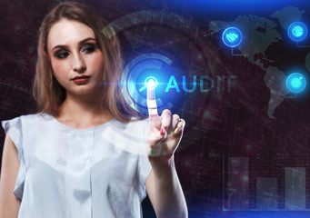 The concept of business, technology, the Internet and the network. A young entrepreneur working on a virtual screen of the future and sees the inscription: Audit