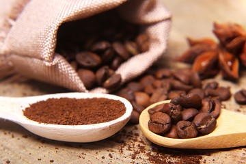 close-up different types of coffee beans on wooden spoons, anise star, macro, set