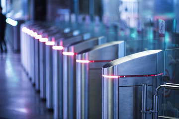 Glowing Turnstiles on an entrance to the subway