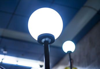 Fluorescent round lamps line at metro station