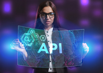 The concept of business, technology, the Internet and the network. A young entrepreneur working on a virtual screen of the future and sees the inscription: API