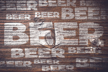 Beer menu on an old wooden plank