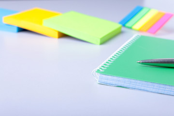 Business concept. Top view of kraft spiral notebook, glasses and pen isolated on background for mockup.