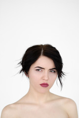 emotion face. sad depressed downcast gloomy low spirited woman. young beautiful brunette girl portrait on white background.