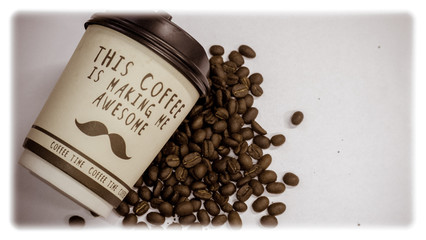 A cup of coffee with the words "This coffee making me awesome" beside coffee bean.