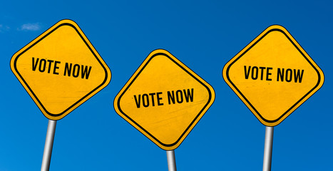 vote now - yellow sign with blue sky