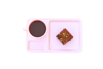 chocolate cake Sprinkle with nuts and coffee cup in pink saucer Top view on isolated on white background clipping path