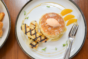 Pancake with banana on a plate