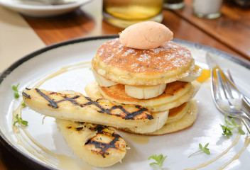 Pancake with banana on a plate