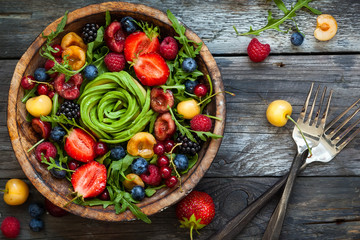 Fresh salad with fruit,berry and vegetables.