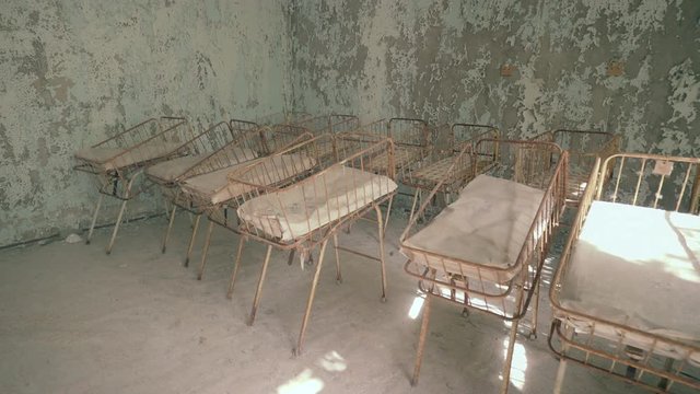 Neonatal ward in abandoned hospital of Pripyat. Chernobyl nuclear disaster. Slider shot - Juni 2017: 30km Chernobyl, exclusion zone