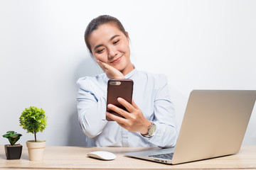 Woman use smartphone at office