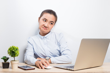 Woman show disgust when she look at laptop