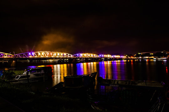 Illuminated bridge at night in Hue, Vietnam