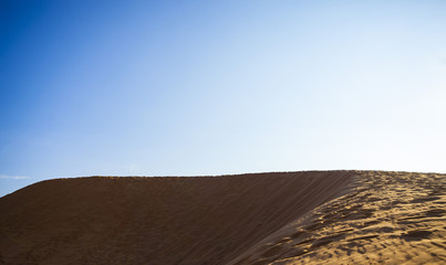 Fototapeta na wymiar Red Sand Dunes and Sky near Mui Ne, Vietnam.