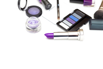 Obraz na płótnie Canvas Set of make-up cosmetics for violet make-up on a white background. Copy space