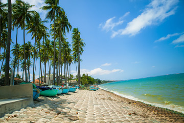 Beautiful beach with blue sky and coconut in Mui Ne, Binh Thuan province, Vietnam