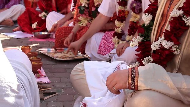 Indian weddings, newlywed. Newlyweds spend wedding custom. Fragment of wedding ceremony
