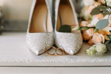Wedding shoes and wedding paraphernalia, wedding gold rings,, wedding bouquet