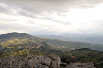 mountains high in the clouds, covered with trees