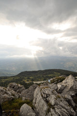 mountains high in the clouds, covered with trees