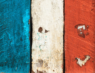 French flag made of painted wood planks. Grungy texture or background.