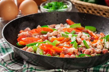 Frieding ingredients for preparing omelette