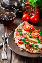 Omelette with bacon and tomatoes