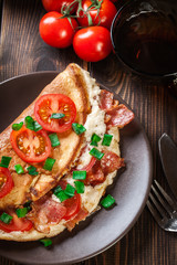 Omelette with bacon and tomatoes
